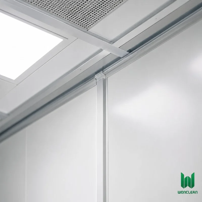 Close-up engineering view of clean room sandwich panel and ceiling grid joint