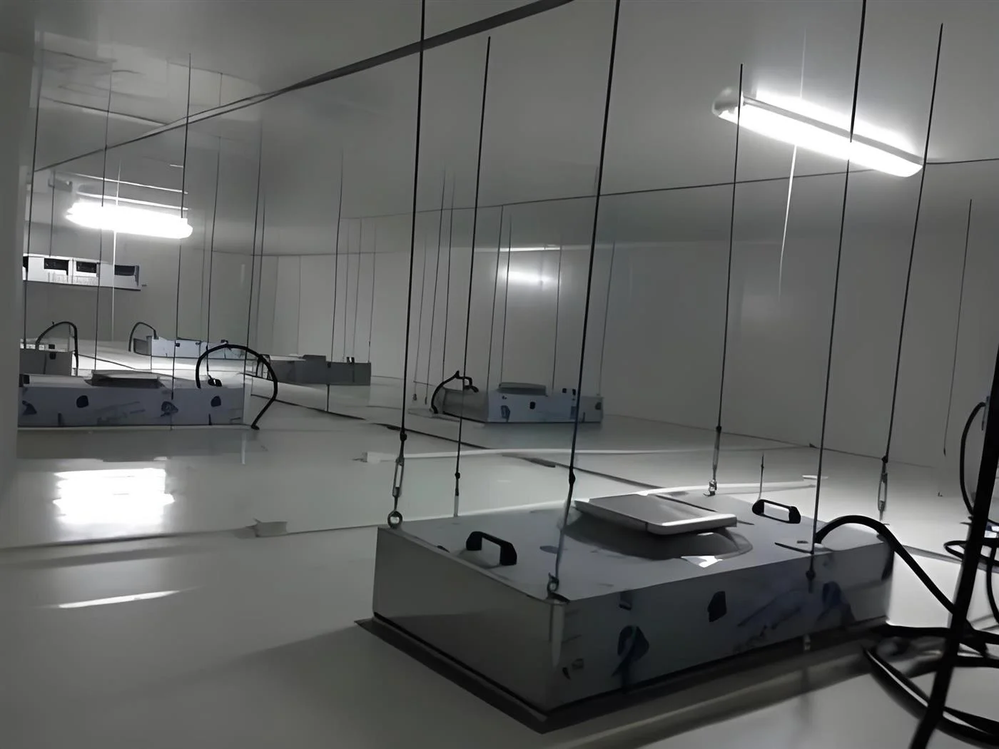 FFU ceiling service layer above a cleanroom with fan filter units and suspended ceiling structure