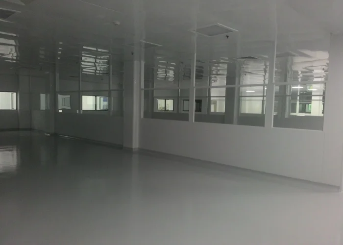 Modular cleanroom lab interior with cleanable work surfaces and HVAC ceiling diffusers