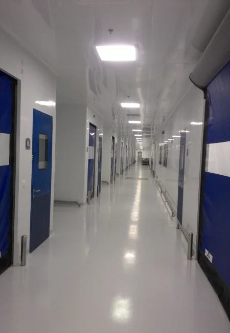 Sterile cleanroom corridor with cleanable wall panels windows doors and ceiling supply interfaces