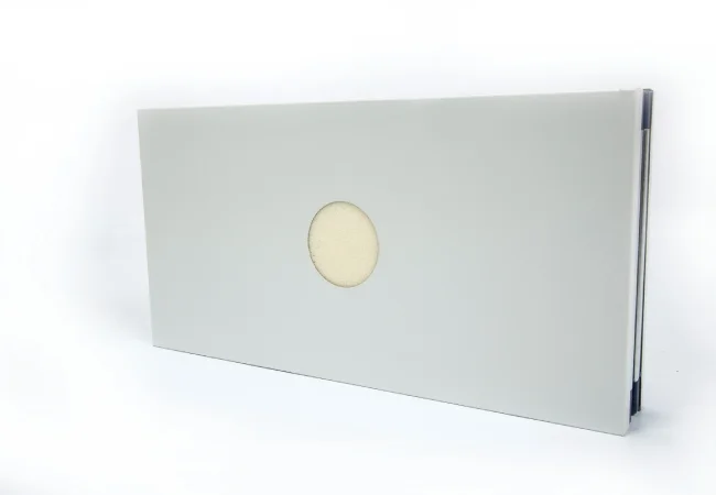 Real cleanroom wall panel with factory prepared circular penetration for service routing