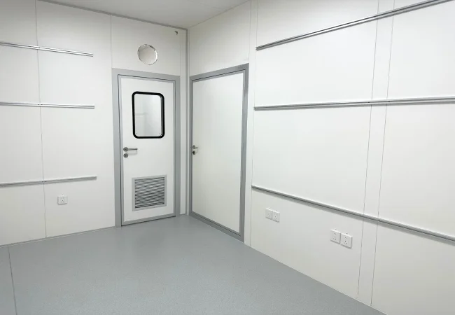 Factory built container laboratory module for temporary pharmaceutical QC space with cleanroom panels and cleanroom door