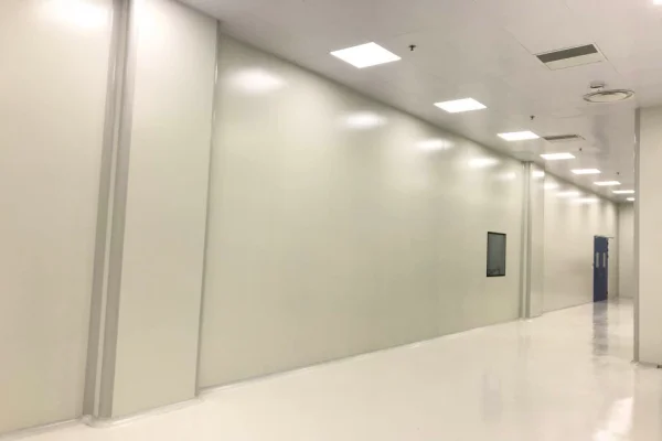 Wonclean real project photo showing cleanroom wall panel joints along a corridor beside cleanroom doors